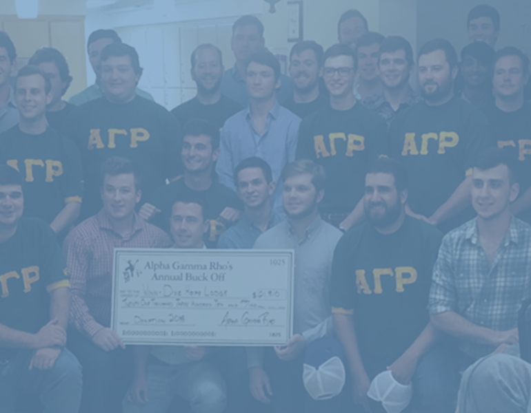 Blue filter over photo of several young men posing with a large fundraising check. 