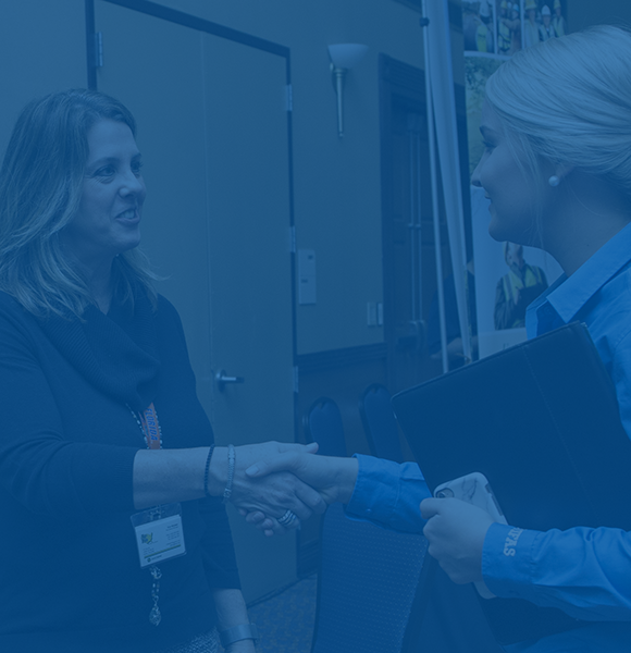 Female CALS student shaking hands with an employer