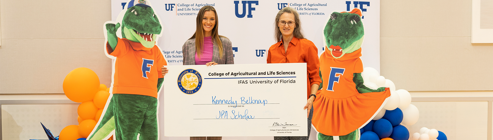 Dean Turner poses with student who is receiving a CALS Scholarship. 