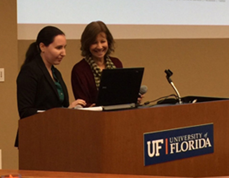 CALS Faculty stand at a podium at the UF Advising Conference 