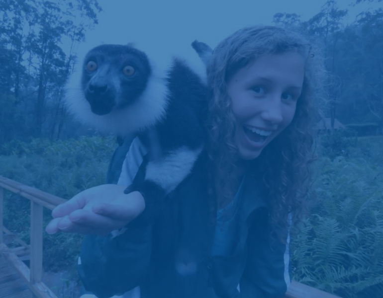 A student with a monkey on their shoulder