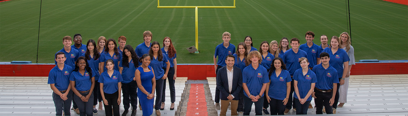 Florida Youth Institute participants pose for a photo in Ben Hill Griffin Stadium with goal post in background.